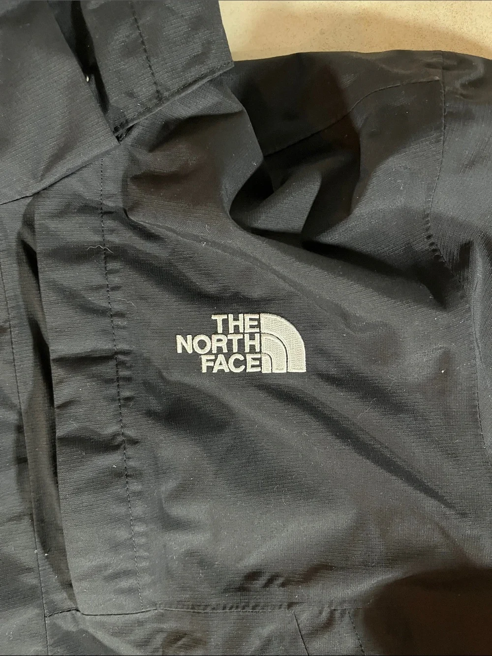 The North Face Men’s Black Hooded Raincoat with Logo